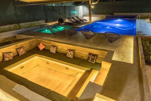 an overhead view of a swimming pool with a table and chairs at Gigiri Lion Villas in Nairobi