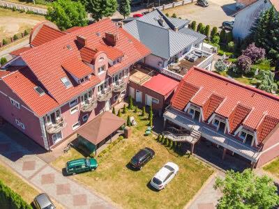 an aerial view of a house with cars parked in front at Tedi 2 in Rewal