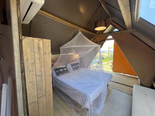 Postel nebo postele na pokoji v ubytování Glamping Tuscany - Podere Cortesi
