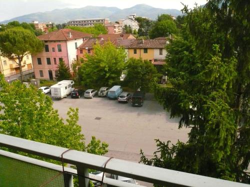 a view of a parking lot with cars parked at Single room in Lucca