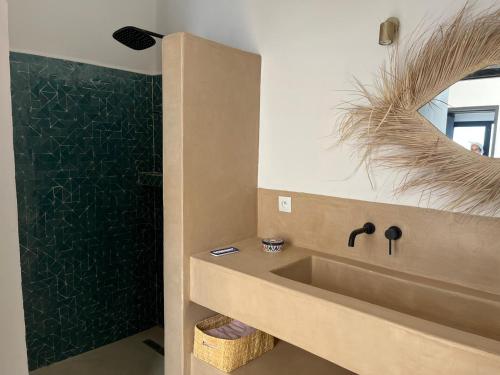 a bathroom with a sink and a shower at Très belle villa avec piscine et vue incroyable sur mediterannée (DAR NAIM) in Tangier