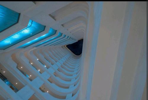 a ceiling with blue lights in a room at Pearls Studio Inland Facing - Self Catering in Durban