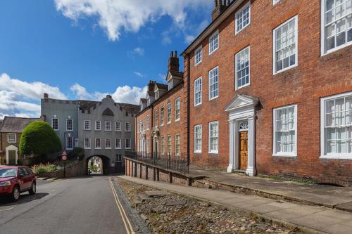 an empty street in front of a brick building at Ludlow Townhouse in Ludlow
