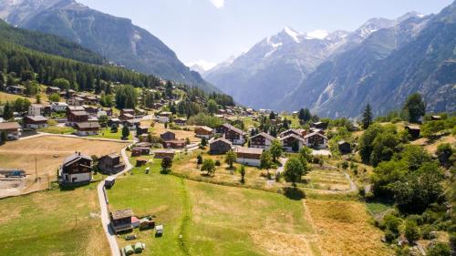 an aerial view of a village in the mountains at Pop-Up Camping Grächbiel in Grächen