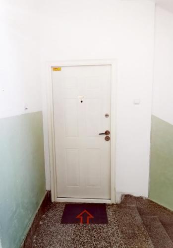 a door with a x on it in a room at Central apartment in Prilep in Prilep