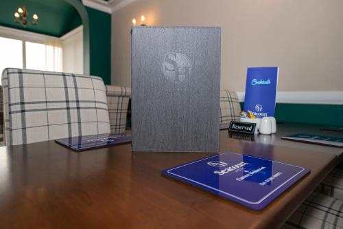a conference room with a table with two chairs at The Seacourt in Bridlington