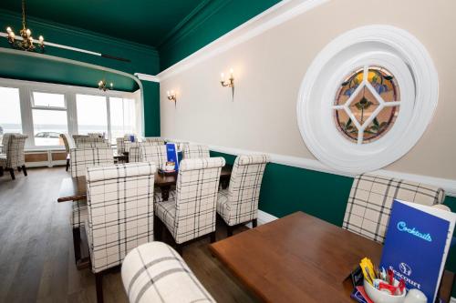 a dining room with a table and chairs at The Seacourt in Bridlington