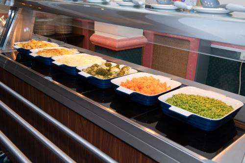 a buffet line with different types of food in bowls at The Seacourt in Bridlington