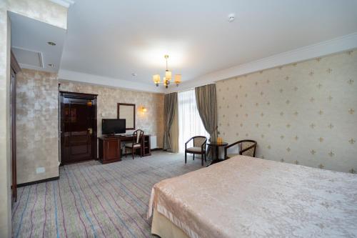 Postel nebo postele na pokoji v ubytování President Resort Hotel