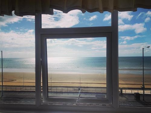 a view of the beach from a window at The Seacourt in Bridlington