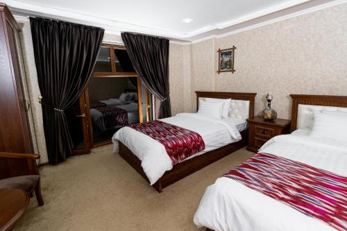 Letto o letti in una camera di CRYSTAL GUEST HOUSE