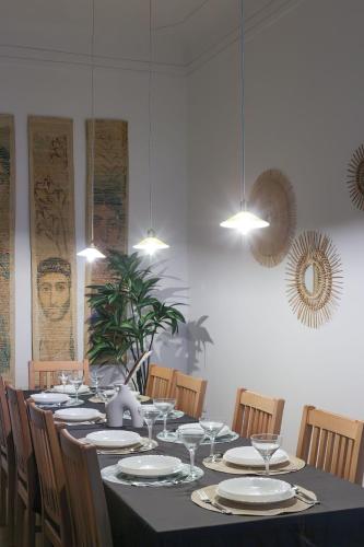 a dining room with a long table and chairs at Nabeel Homes - Seaview Rooftop - San Stefano in Alexandria