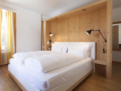 Postel nebo postele na pokoji v ubytování Hotel Müller - mountain lodge