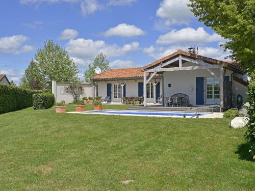 a house with a swimming pool in a yard at Villa in France with Private Pool in Vasles