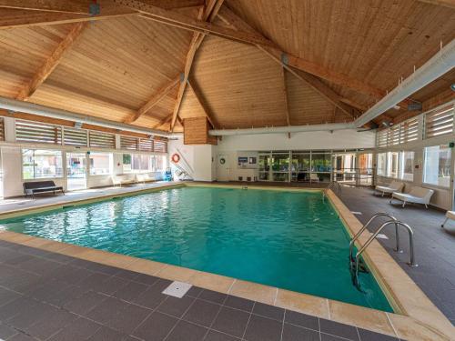 a large swimming pool in a building at Nice studio with included linen package in the Loire in Saumur