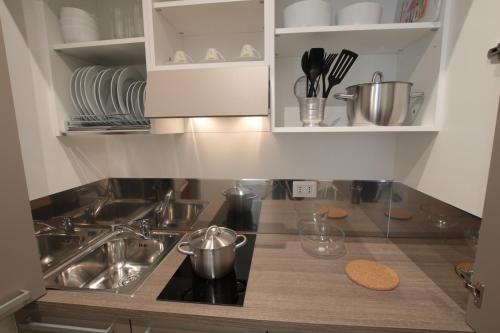 a kitchen with a sink and a counter top at Marcona24 in Milan