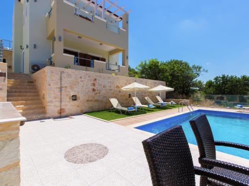 a view of a villa with a swimming pool at Villa in Crete with Private Pool & Beaches Nearby in Achlades