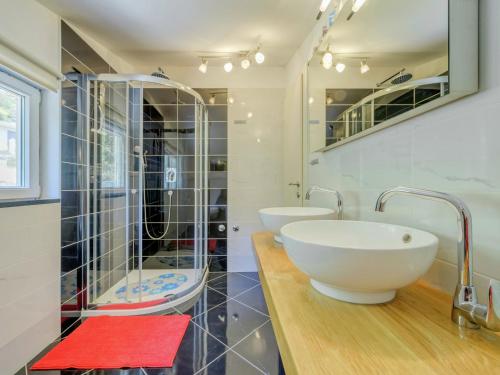 a bathroom with two sinks and a shower at Villa in Solin with Private Pool and Garden in Solin