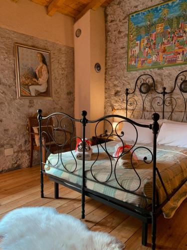 Postel nebo postele na pokoji v ubytování Baita Borgo Incantato