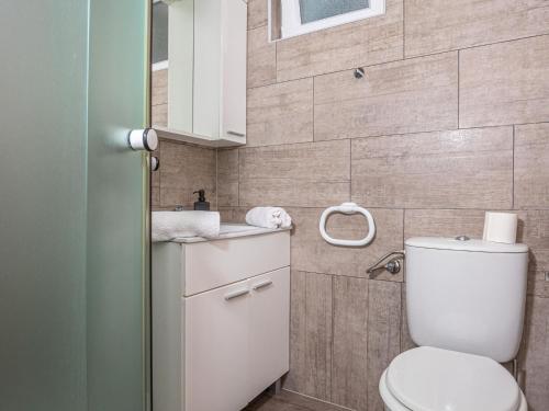 a bathroom with a toilet and a sink at Holiday Home Dramalj with Pool near Sea in Dramalj