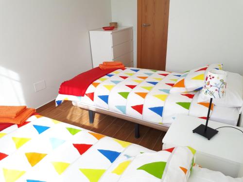 Postel nebo postele na pokoji v ubytování Apartamentos Somo