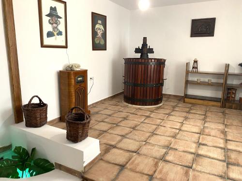 a room with a large room with a floor with aibo at Casa Del Amigo Carmelo in Ye