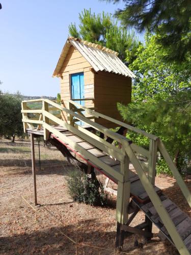 a small house sitting on top of a wooden bridge at Casalustro in Citta' Sant'Angelo
