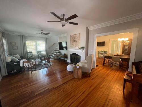 a living room with wooden floors and a ceiling fan at St Petersburg Vacation Rentals in St Petersburg
