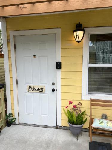 a white door on a house with a sign on it at St Petersburg Vacation Rentals in St Petersburg