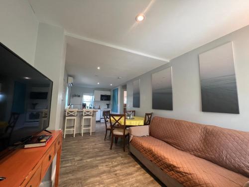 a living room with a couch and a table at St Petersburg Vacation Rentals in St Petersburg