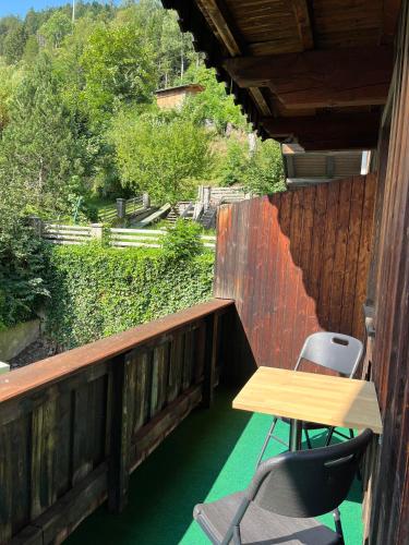 a table and chairs on the balcony of a house at Pension Steiner, 6143 Matrei am Brenner!!Check-in between 15 - 21 o'clock!! No breakfast in Mühlbachl