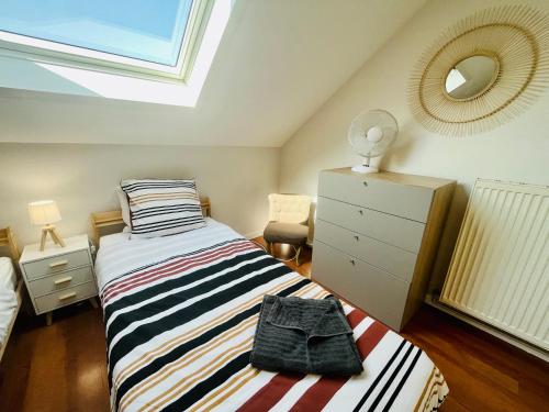 Postel nebo postele na pokoji v ubytování Votre appartement au cœur d'Annecy