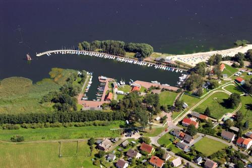 an aerial view of a marina with a dock at Apartment am Stettiner Haff in Mönkebude