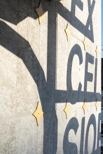 a shadow of a tree on a wall with stars at Hotel Excelsior in Kassel