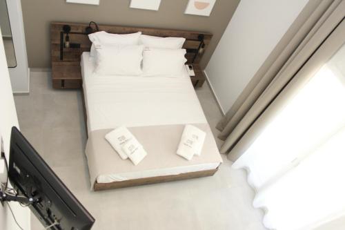 Ένα ή περισσότερα κρεβάτια σε δωμάτιο στο UrbanBay Hotel & Spa