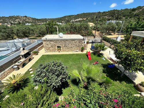 an aerial view of a garden with a building at BIO Garden Stonehouse in Gonia