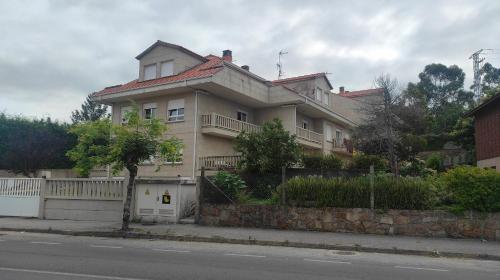 a large house on the side of a street at Amaral Miramar in Boiro