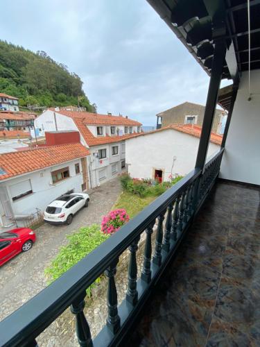 a balcony with a view of a parking lot at Casa Gin Tazones in Tazones