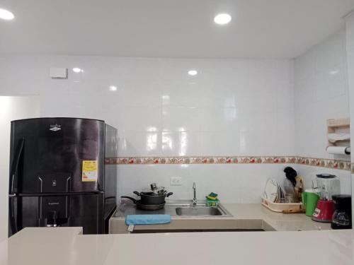 Kuchyň nebo kuchyňský kout v ubytování Apartamento turistico Mariangel