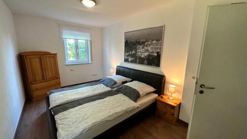 Ένα ή περισσότερα κρεβάτια σε δωμάτιο στο Ferienwohnung in Oberschondorf mit Terasse