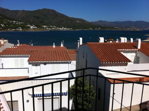 a view of the water from the balcony of a building at Hostal German in Port de la Selva