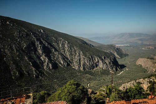 a view of a mountain with trees and a valley at Kastalia Boutique Hotel in Delfoi