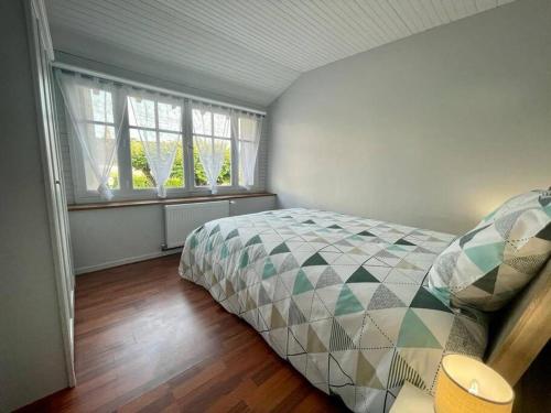 Postel nebo postele na pokoji v ubytování Maison
