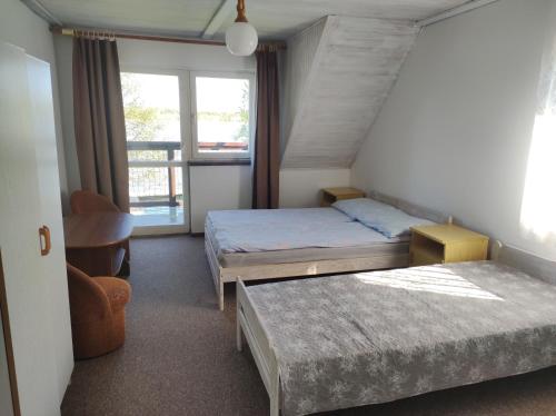 A bed or beds in a room at Stara Plaża