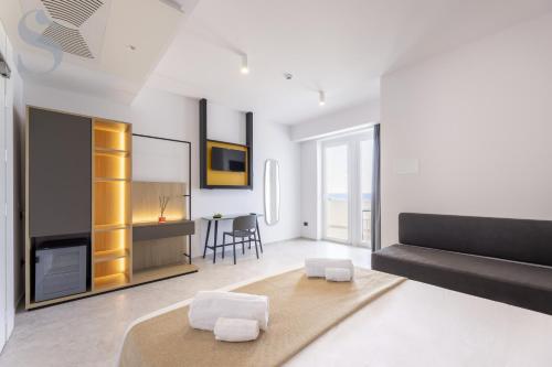 Postel nebo postele na pokoji v ubytování Sud Hotel Pulsano