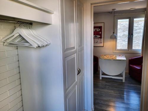a door leading into a room with a bath tub at Cozee Central Apartments in Stavanger
