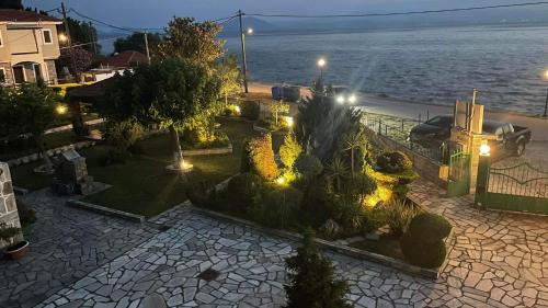 an aerial view of a garden with lights at night at Anemos Pelion Seaview in Kala Nera