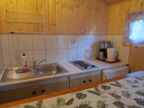 a kitchen with a sink and a counter top at OW ZŁOTA PLAŻA in Mielno
