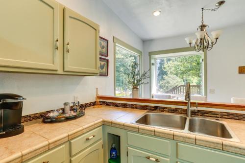 a kitchen with a sink and a window at Big Bar Home with Hot Tub and Fire Pit! in Big Bar