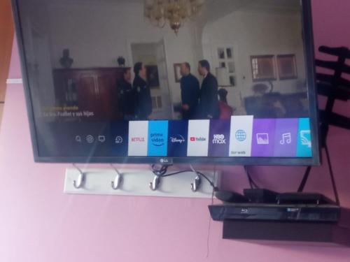 a flat screen tv sitting on a shelf at Departamento en Huancayo in Huancayo